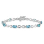 10k White Gold Blue Topaz and Diamond Infinity Bracelet - Image 3